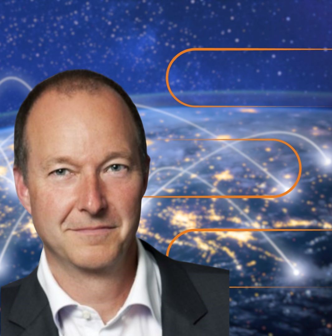 A man in a suit is shown in front of a digital background featuring a global map at night, illuminated city lights, and orange lines representing data connections across continents. EFESO Management Consultants