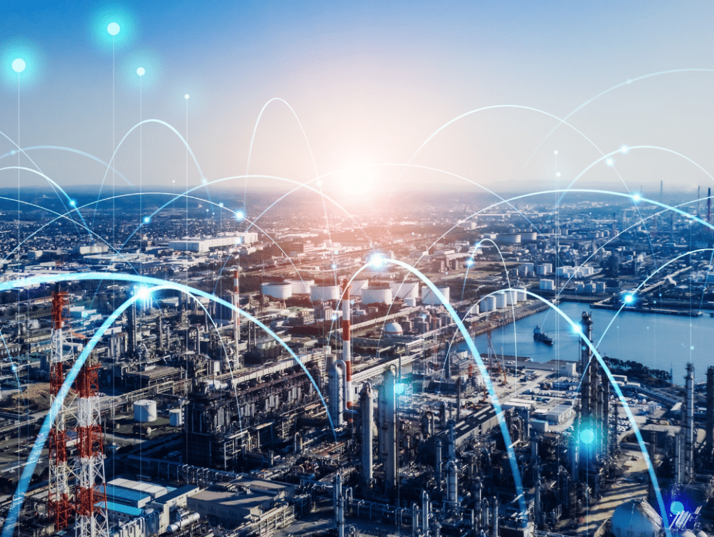 Aerial view of an industrial cityscape with factories, smokestacks, and a river, overlaid with digital lines and glowing nodes representing wireless communication and network connectivity. EFESO Management Consultants